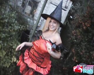 blonde poses witch costume